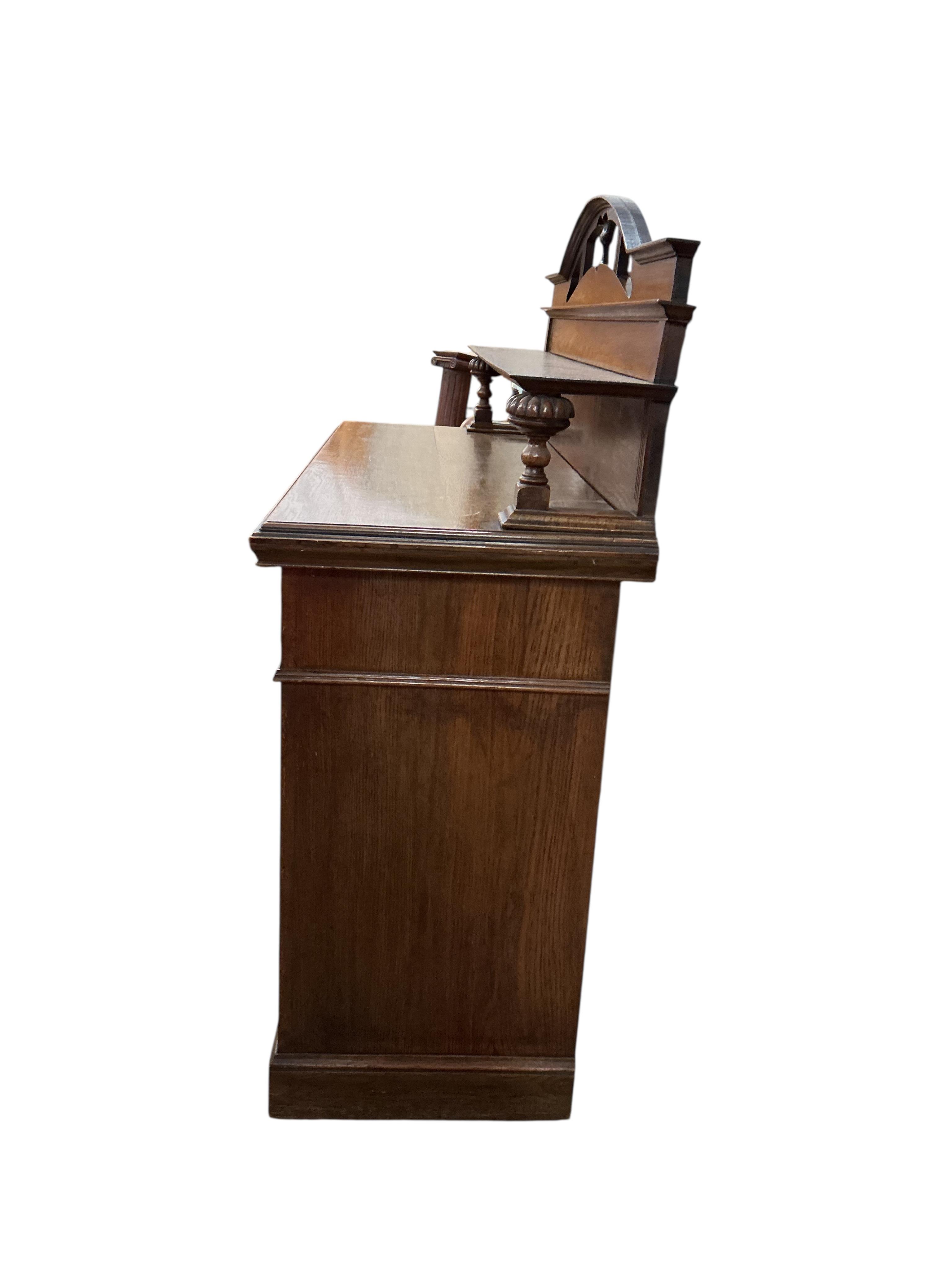 A late Victorian Art Nouveau oak sideboard, width 137cm, depth 54cm, height 140cm